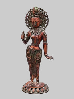 Standing Tara brass idol, raised palm gesture, detailed torso and draped attire