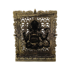 Brass Ganesh panel back with decorative cutout lattice and dark inner backing