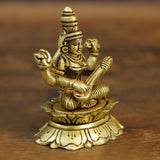Seated Maa Saraswati brass statue in meditative pose, detailed jewelry