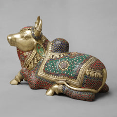 Seated Nandi brass sculpture, side view with ornate jeweled patterns on body and headgear