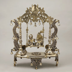 Brass Radha and Krishna jhula front view with canopy bells and engraved base stand