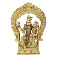 Brass Shiva and Parvati idol seated on ornate Kirtimukha throne, 10 inch