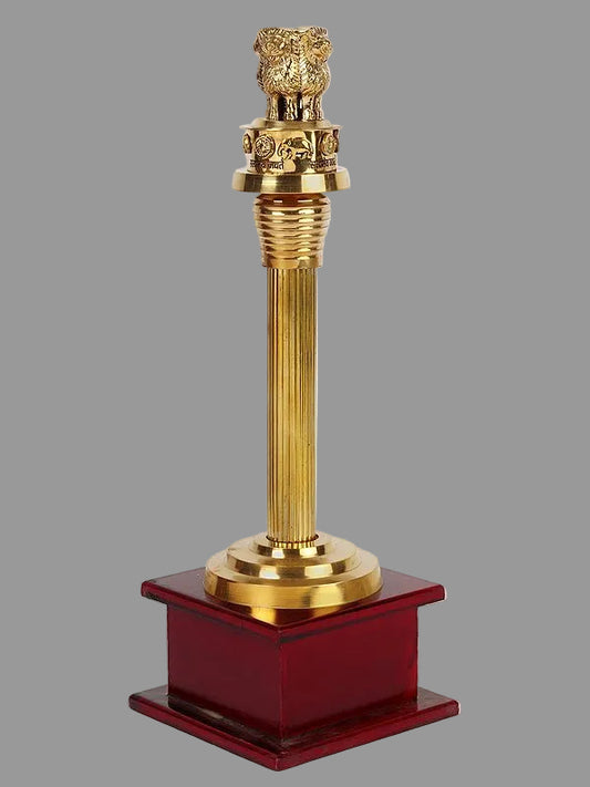 Brass Ashoka stambh with lion top on glossy red base