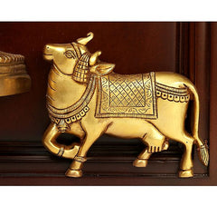 Gold decorative cow figure wall ornament with ornate harness, mounted in wooden frame