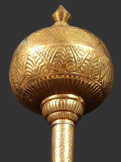 Decorative brass gada with detailed engraved spherical head and ribbed base, home temple