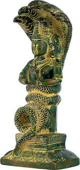 Brass green Patanjali idol, side view with head detail and seated draped torso