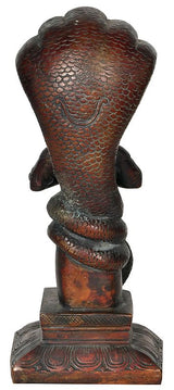 Back view of brass red Chola Patanjali idol, seated, textured scales and drapery