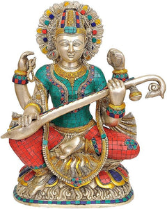 Brass Saraswati playing the veena statue, seated with ornate headdress and colorful outfit