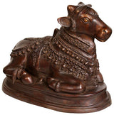 Handcrafted brass bull vahana statue, angled view showing textured armor-like ornamentation