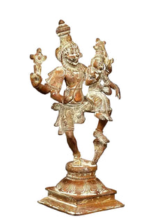 Brass Lord Narsimha statue with raised arms and Devi Lakshmi, gold-toned on pedestal base