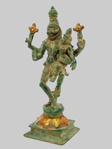 Brass multi-armed deity sculpture with green patina, gold accents, full-body front view