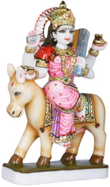Shitala Mata figurine on cow base, red sari, pink skirt, raised hand pots.