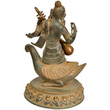 Brass Saraswati goddess on a swan, turned side view, holding veena