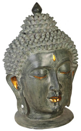 Brass Buddha head showpiece close-up, golden eyelids and amber accents, 29 in tall.