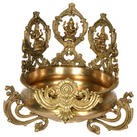 Brass urli with Lakshmi, Ganesha, and Saraswati, ornate deity stand, 15 inch