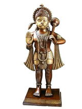 Brass Hanuman statue with raised right hand and holding mace, on square base.