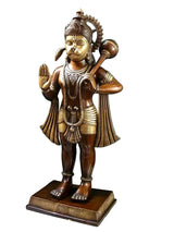 Brass Hanuman statue in three-quarter view, raised hand, holding mace, square base.