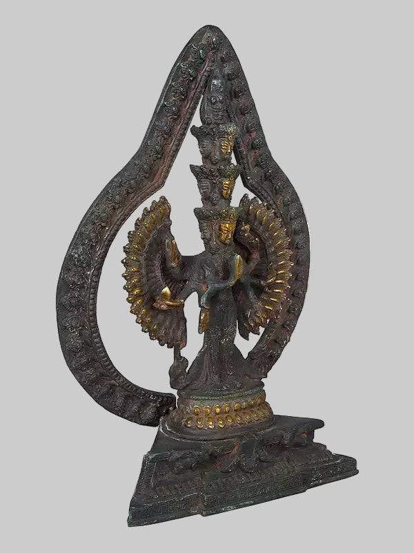 Brass Lord Avalokiteshvara Statue with Striking Aureole | Handmade Buddhist Sculpture for Home Decor (Height: 12 Inches) Entryway Setting