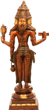 Large brass Lord Brahma statue, three-quarter view with trident and cross on hands