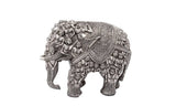 Silver brass elephant statue with intricate relief figures on back