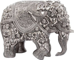 Silver brass elephant statue side view, ornate back panel with relief details