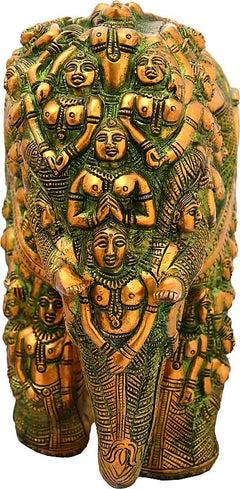 Front view brass elephant statue with clustered deity faces and decorative jewelry