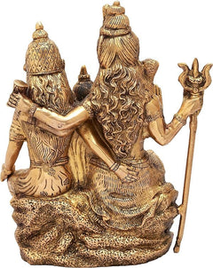 Natural brass Shiva family idol, back view with flowing hair and hand-held trident
