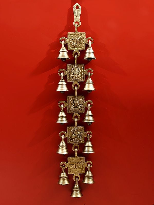 Brass Wall Hanging featuring Lakshmi, Ganesha, and Saraswati with bells (Height: 18 inch)