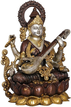 AONA Saraswati brass figure holding veena across lap, lotus pedestal and gilded details