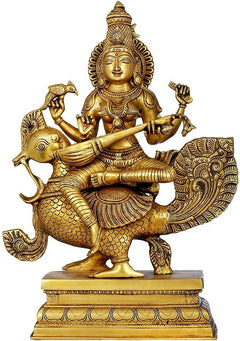 Gold brass Saraswati statue on peacock, holding a veena, 19 inches