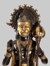 Brass Hanuman face sculpture with ornate crown, gold detailing, holding a raised mace