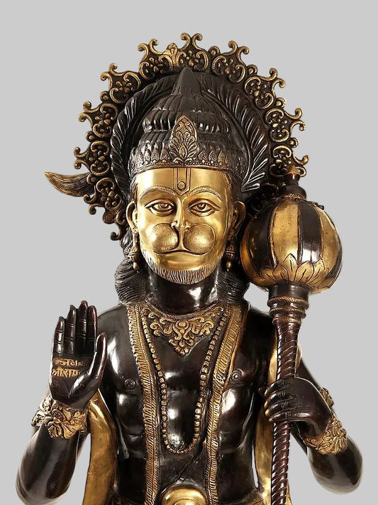 Brass Hanuman face sculpture with ornate crown, gold detailing, holding a raised mace