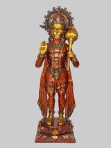 Hanuman blessing statue with golden face and hands raised, standing on carved base