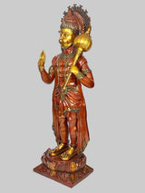Hanuman blessing statue from side view, golden mace raised in right hand