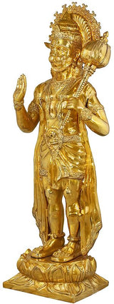 Gold-tone brass Hanuman statue, standing in profile with raised hand and mace