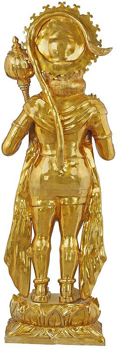 Gold-tone brass Hanuman statue, close view of face with raised club