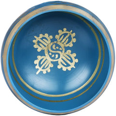 Blue singing bowl top with gold symbol and circular ring detailing; brass finish