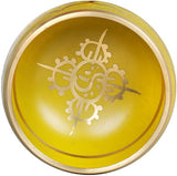 Innenseite der gelben Klangschale mit weißem Buddha-Symbol