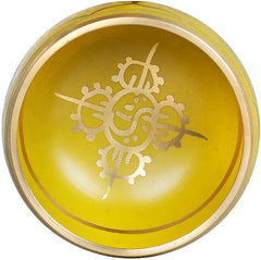 Innenseite der gelben Klangschale mit weißem Buddha-Symbol