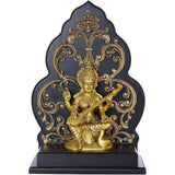Brass Saraswati statue seated on kirtimukha pedestal, holding a veena, gold finish
