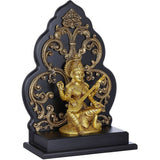 Brass Saraswati statue seated with veena, ornate halo and kirtimukha base, gold-tone