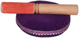 Wooden mallet with red felt tip on purple cushion