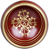 Red singing bowl top with gold lotus/ornament design and concentric rings