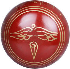 Red Tibetan singing bowl with gold-lined rim and center emblem