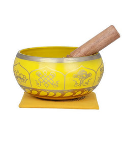 Brass Tibetan singing bowl with cushion and wooden striker, engraved Buddhist symbols