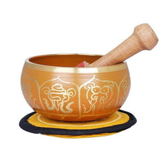 Auspicious Tibetan singing bowl in brass with carved symbols and wooden mallet