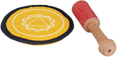 Brass Tibetan singing bowl with yellow cushion and wooden mallet with red felt tip