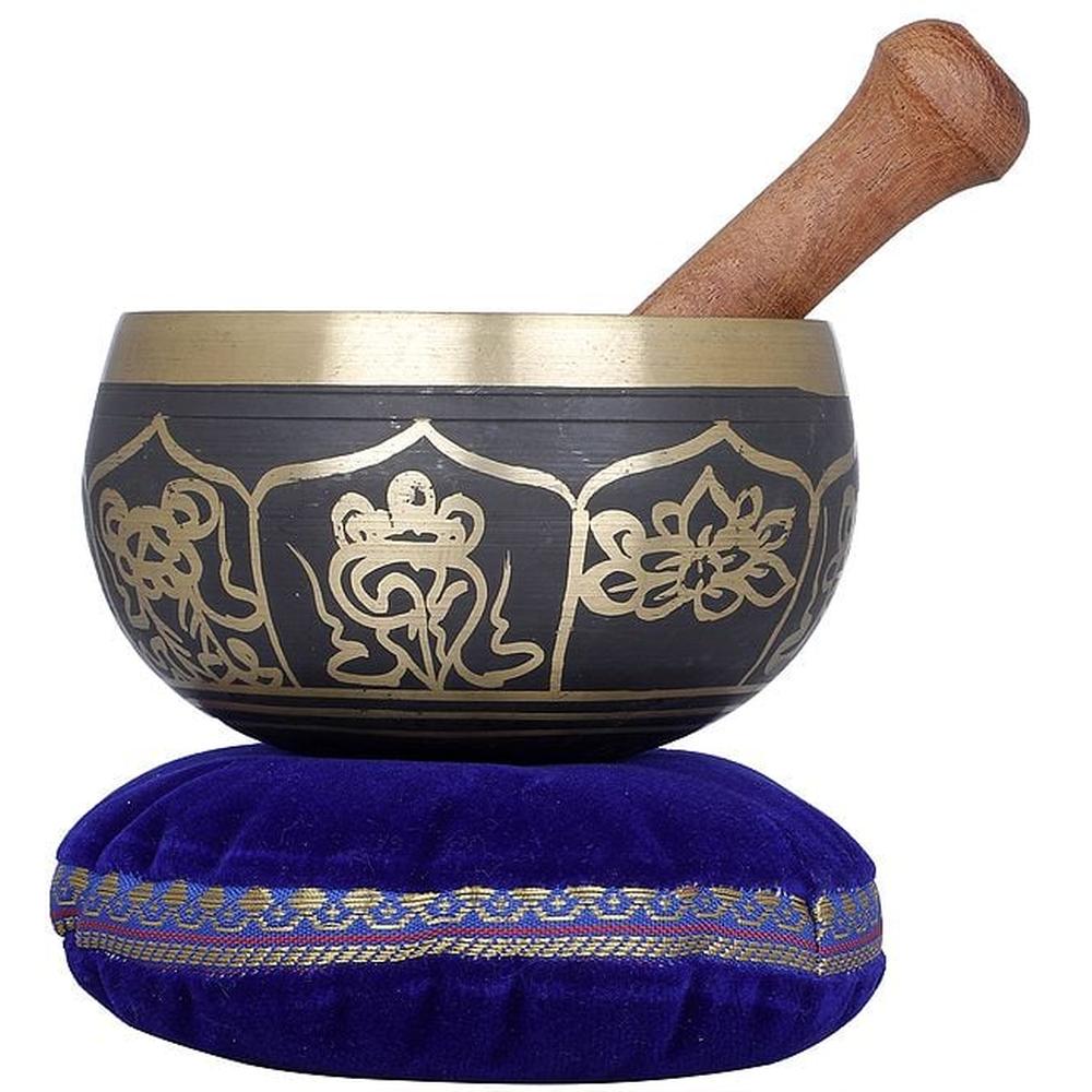 Golden and black brass singing bowl with wooden handle, on blue cushion (6 cm height)