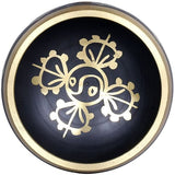 Black brass singing bowl interior with gold floral mandala design and rim detail