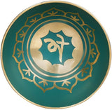 Teal singing bowl top with gold ring and lotus-symbol center motif
